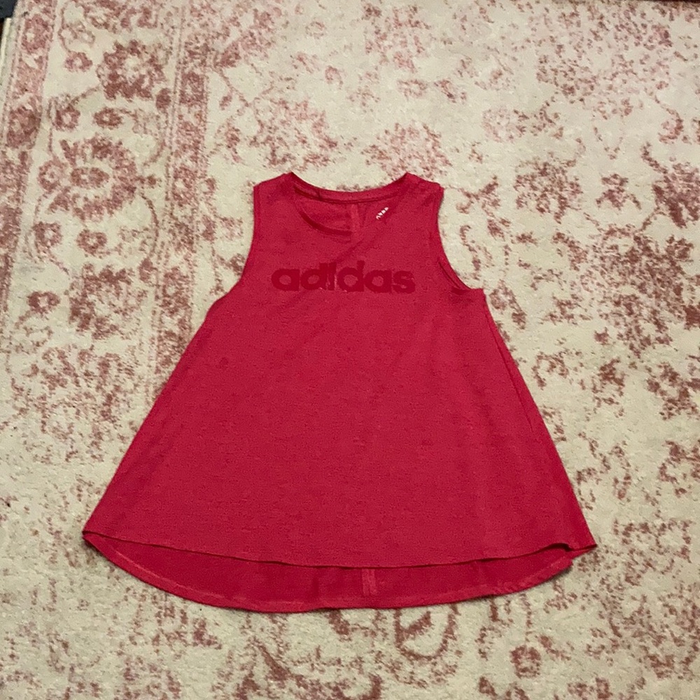 Bright pink tank top.
